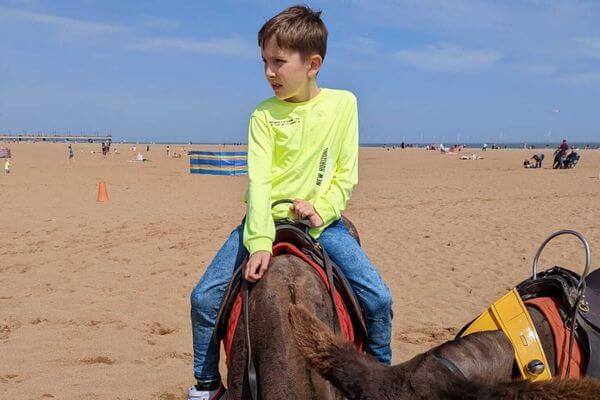 Erika's son, Noah, was riding a donkey