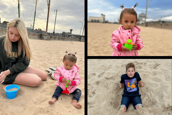 A photos of Jenny's children having a fun time at the beach building sandcastle.