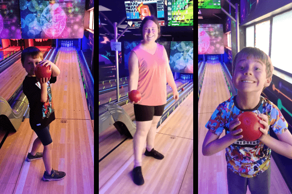 Alistair in the left, Rebecca in the middle, and Elijah in the right posing with a bowling.