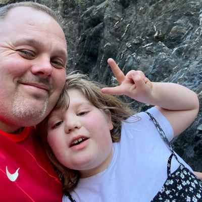 Adrian and daughter Bethany take a selfie on the beach on their family holiday