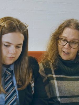 Mandy and Erin sat doing homework