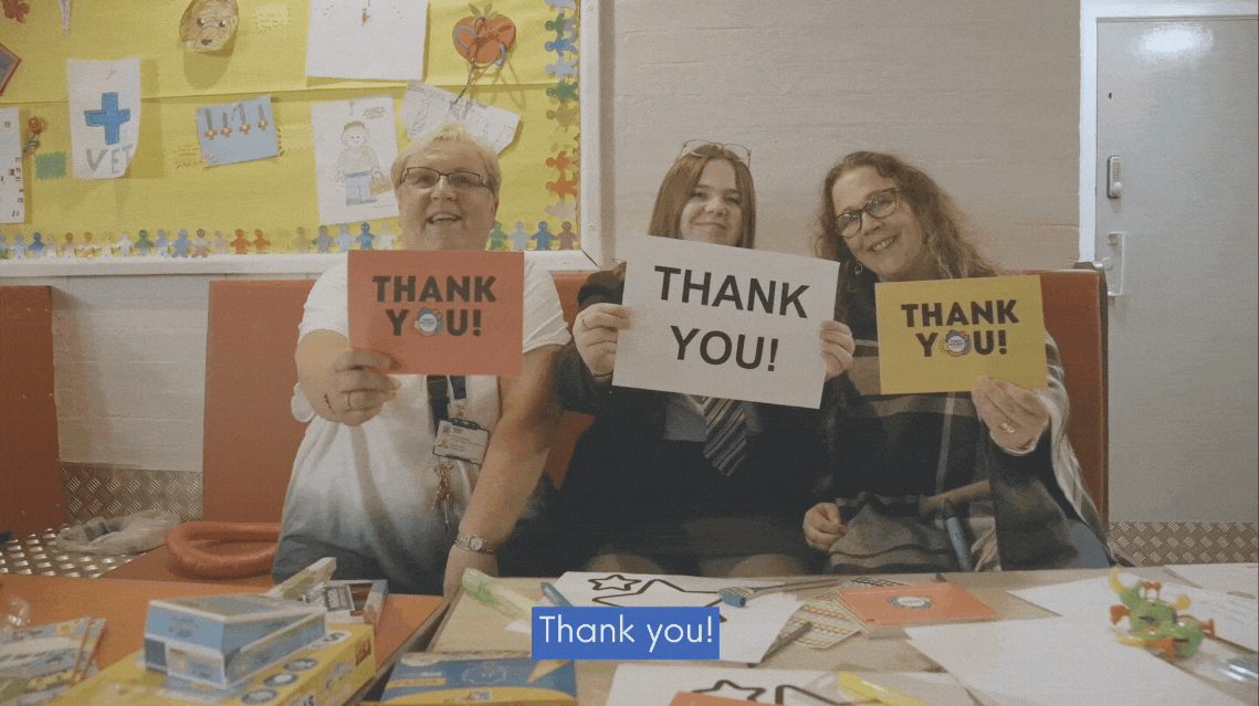 Mandy, daughter Erin and their referrer holding thank you cards