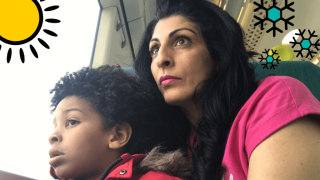 Sabina and her son, Dion looking out the window of the train.