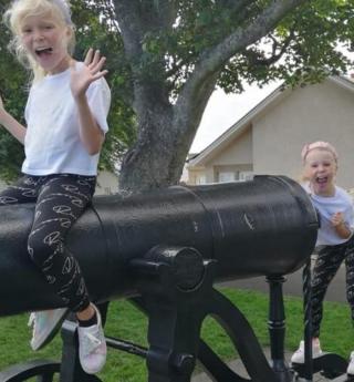 Two girls playing outside