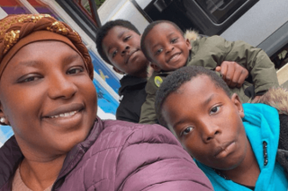 Smiling woman and children