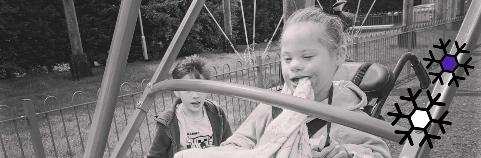 Erika's daughter, Evie, enjoying herself on the swing in the park