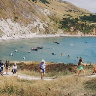 Family walking on a beach on holiday