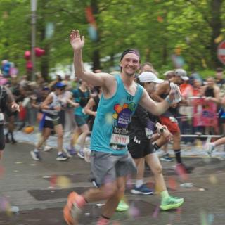 man cheering and smiling as he