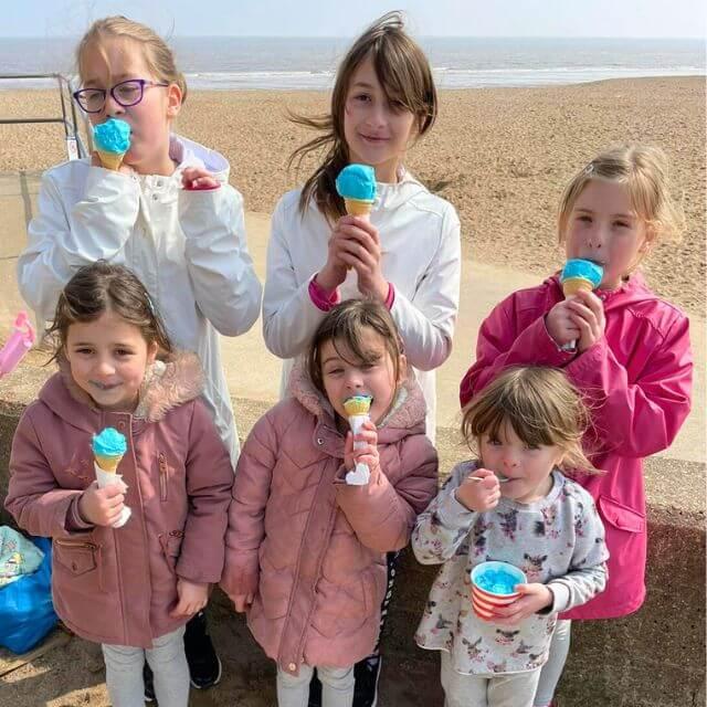 A photo taken by Kevin of her six daughters enjoying ice cream at the beach