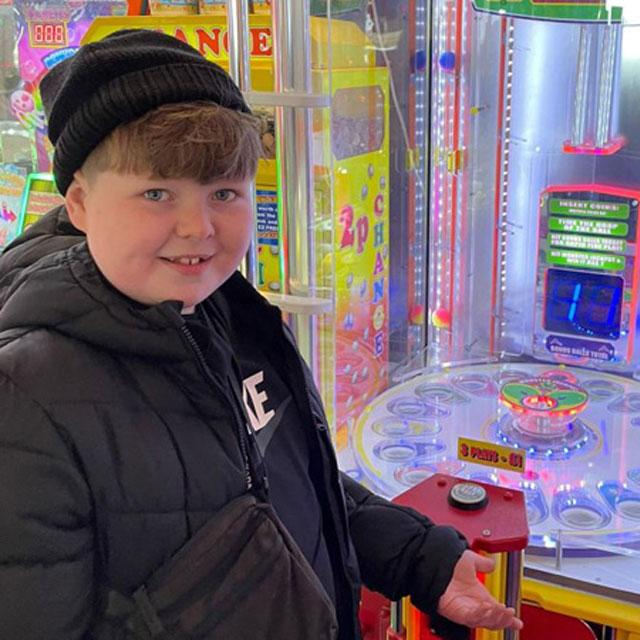 young person at an arcade