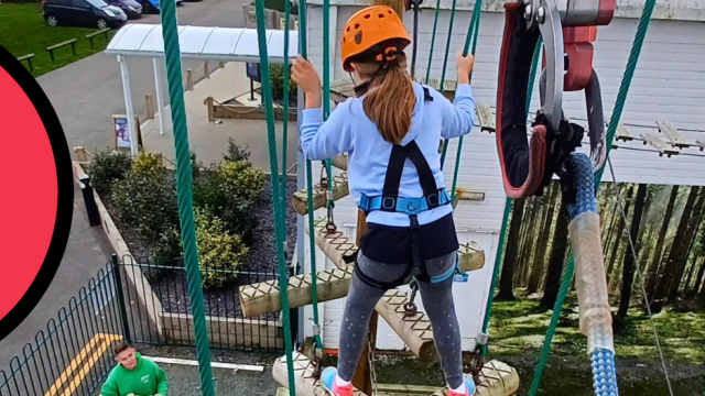 Maria's daughter Lucy takes part in the high wires. Lucy is securely strapped in whilst an instructor guides her from the ground.